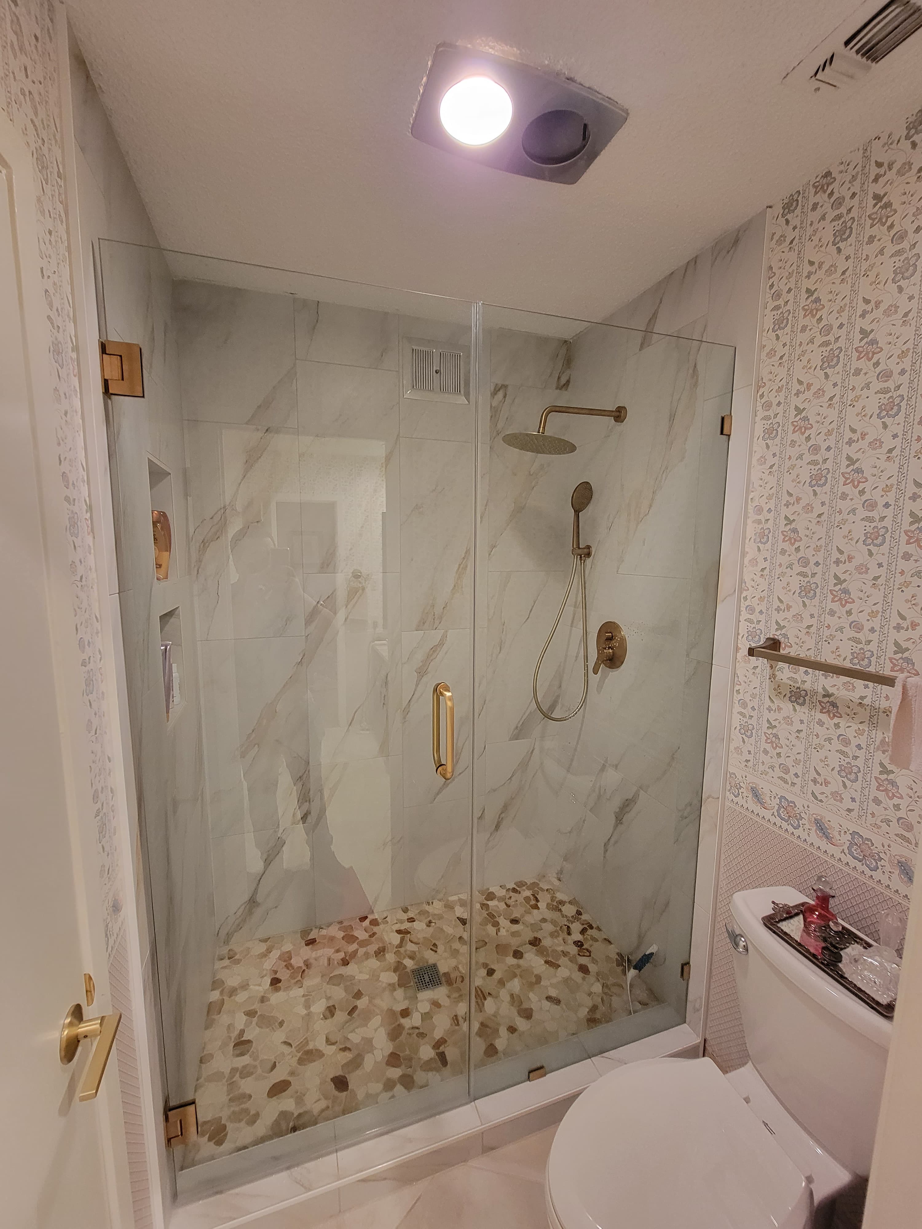 Completed tub-to-shower and walk-in shower project view 1